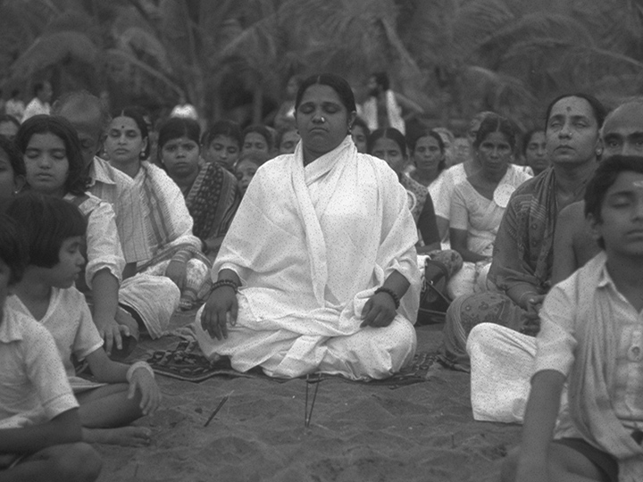 Amma meditating in the beach