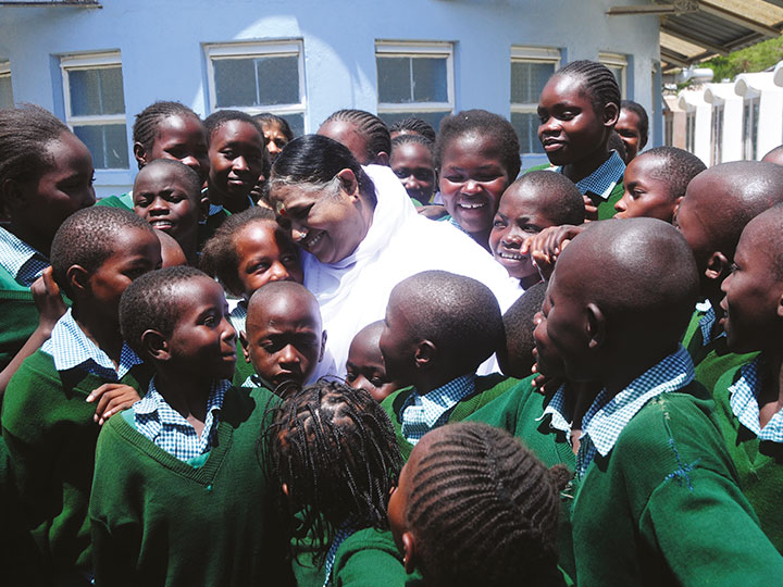 Amma in Kenya with children