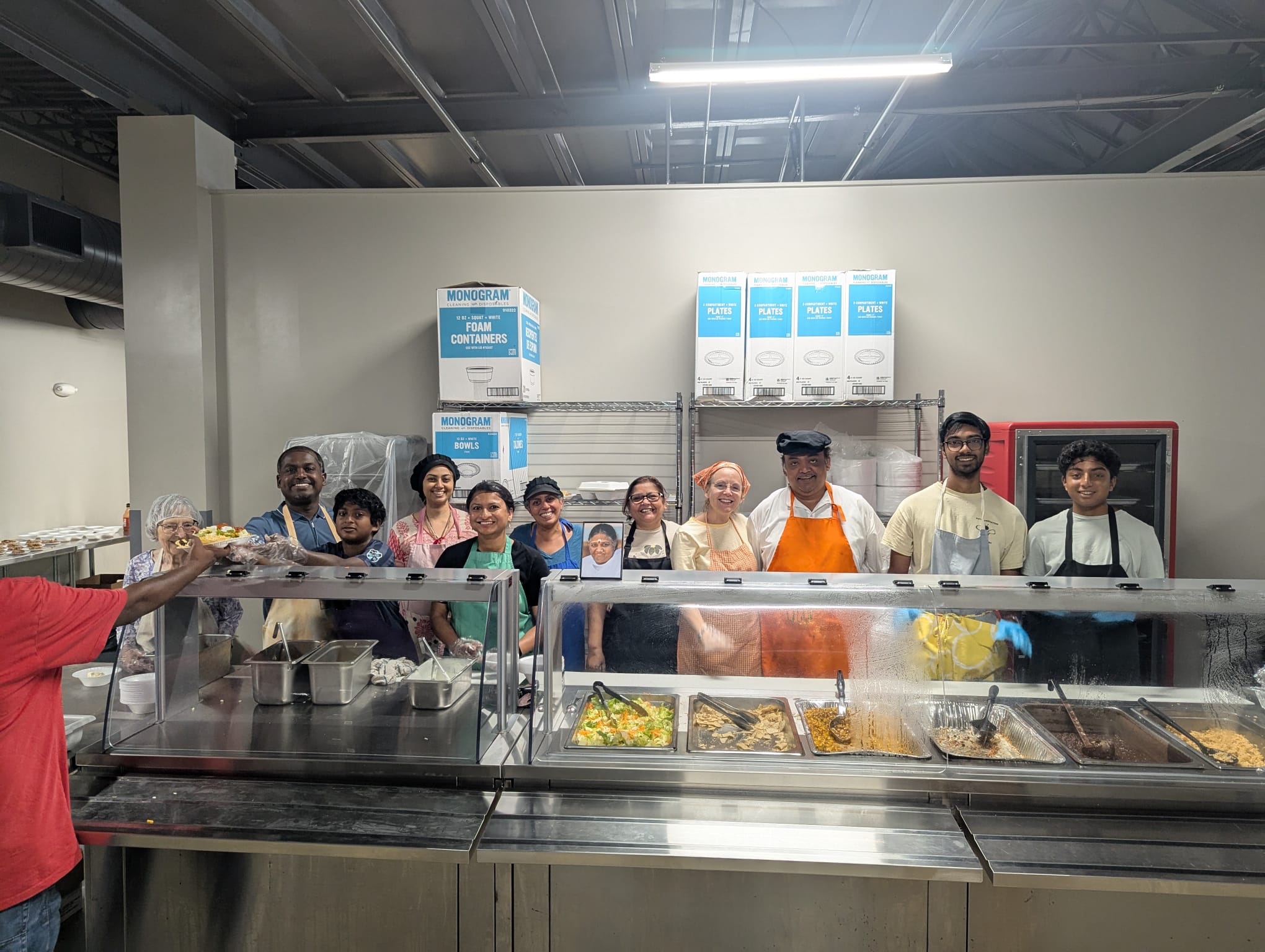 Serving a meal at a community soup kitchen with Mother's Kitchen