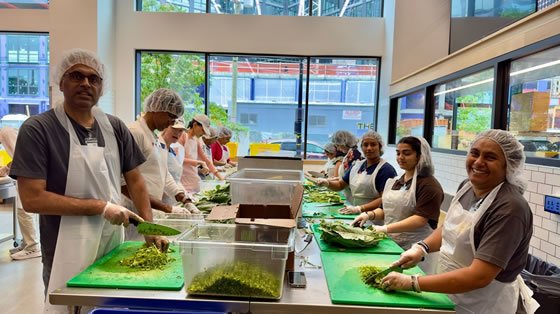 Mother's Kitchen volunteers cooking at M.A. Center DC