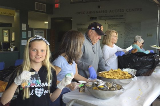 Mother's Kitchen volunteers serving fresh meals