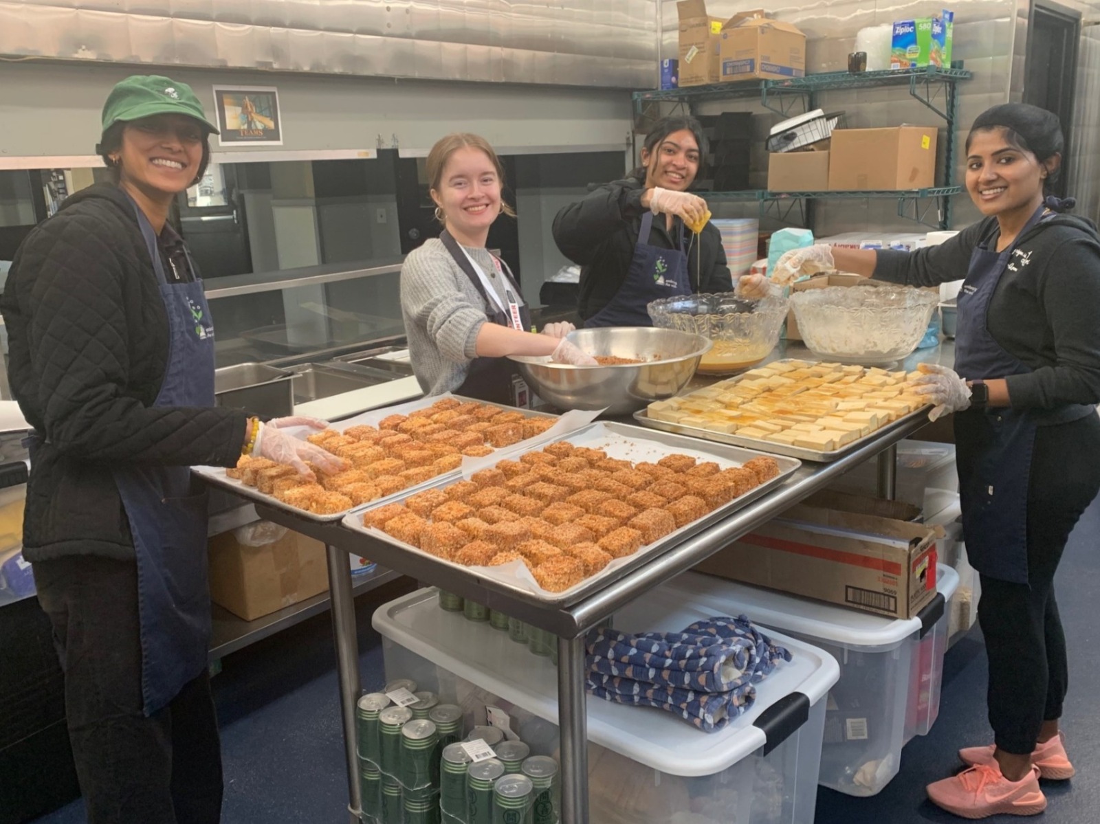 Mother's Kitchen volunteers preparing food trays