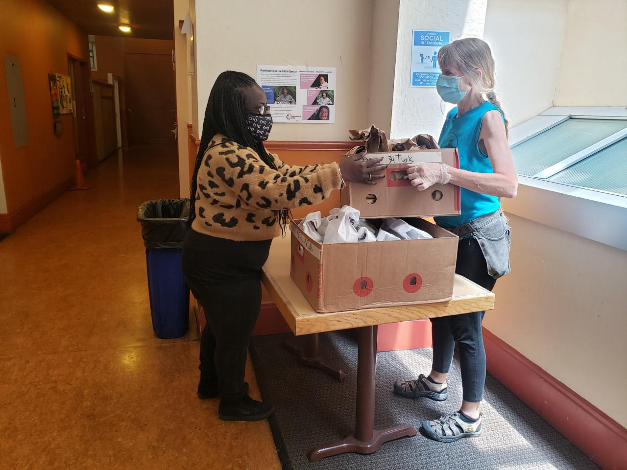 Mother's Kitchen volunteers packing meal bags