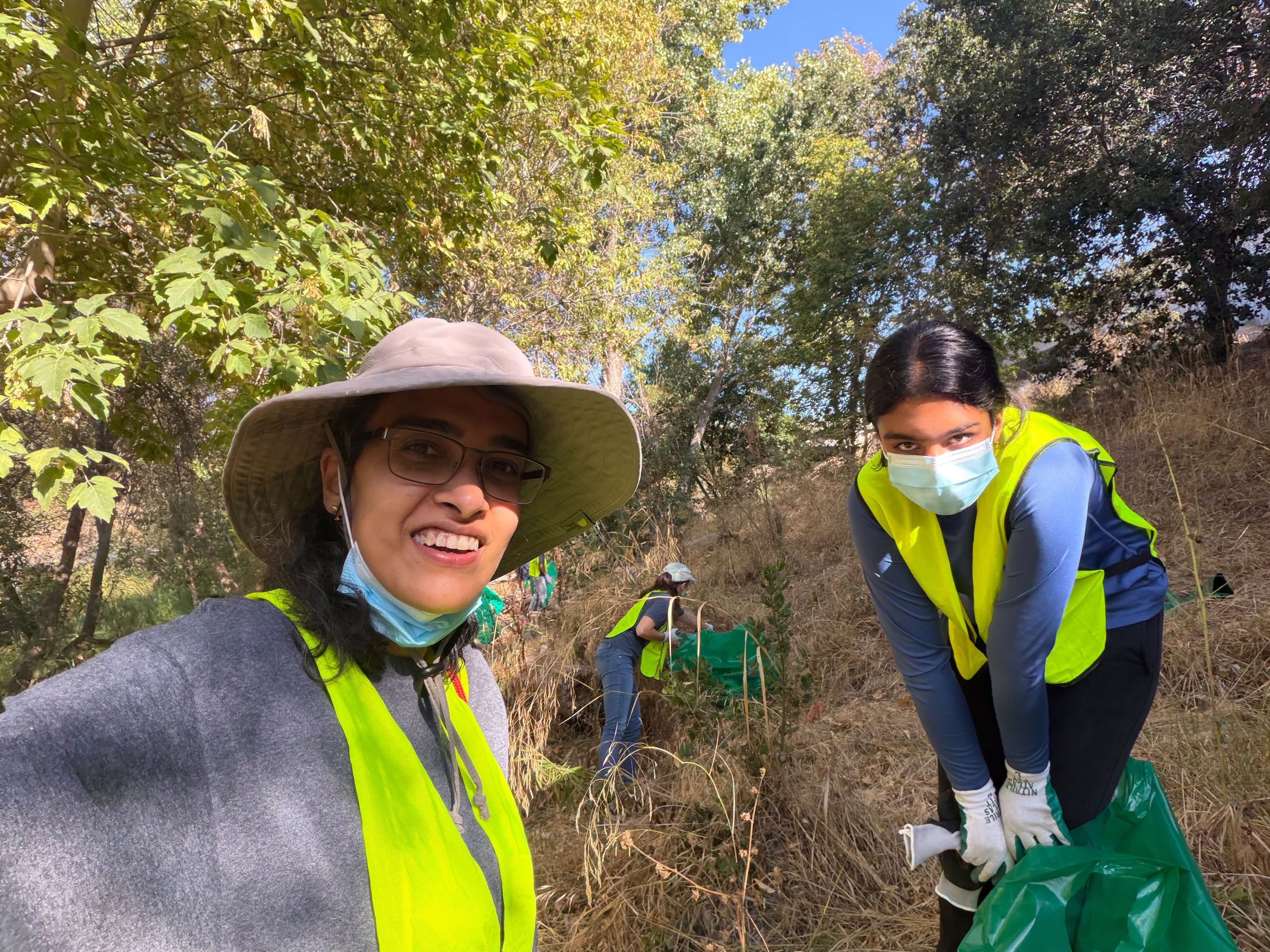 Two MA Center San Ramon volunteers smiling during the Guadalupe River cleanup