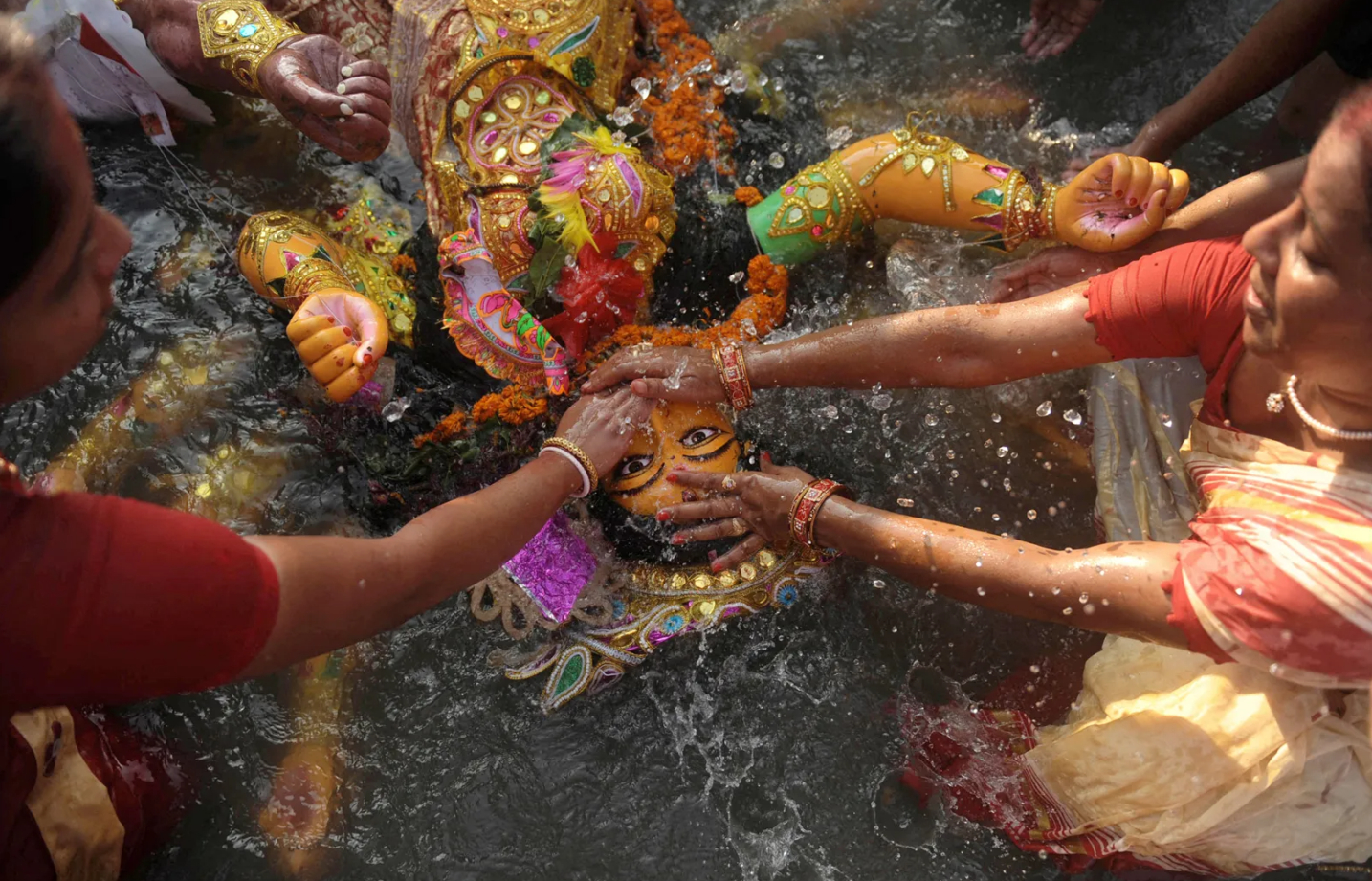 Immersing Durga in water