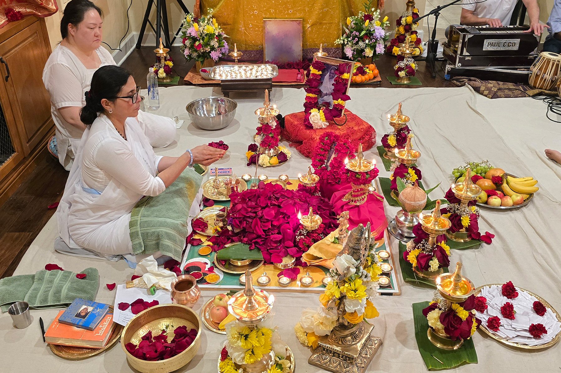 Pujarinis making offerings during the puja