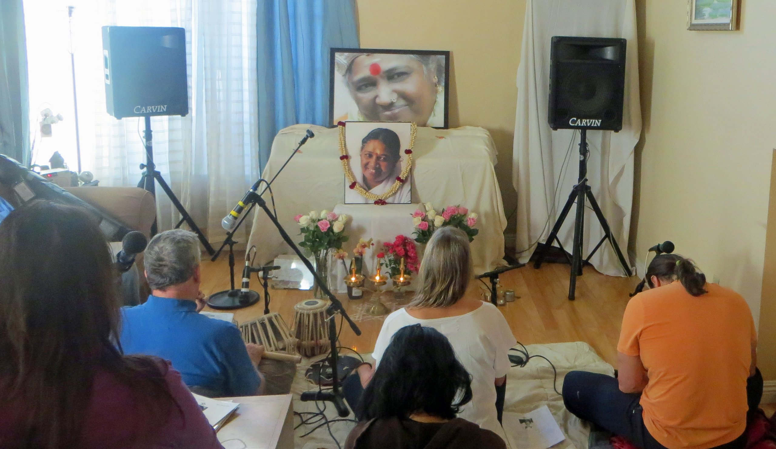 A San Diego satsang gathering, with Amma's photo on the altar