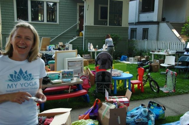 A smiling volunteer at the Vancouver satsang garage sale