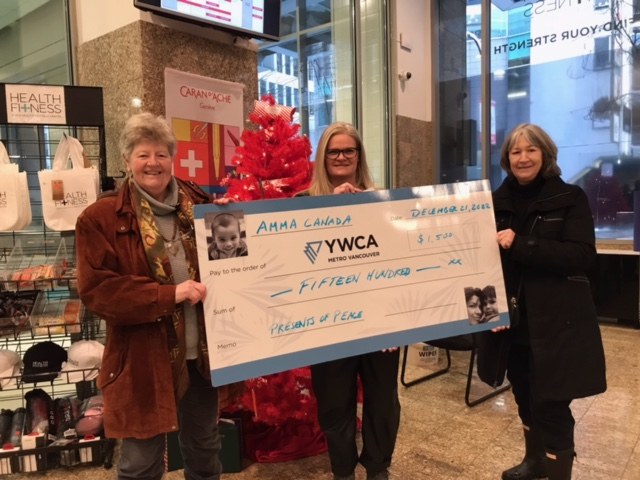Presenting a cheque from Amma to the YWCA in Vancouver