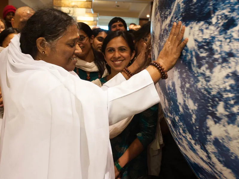 Amma touching Globe
