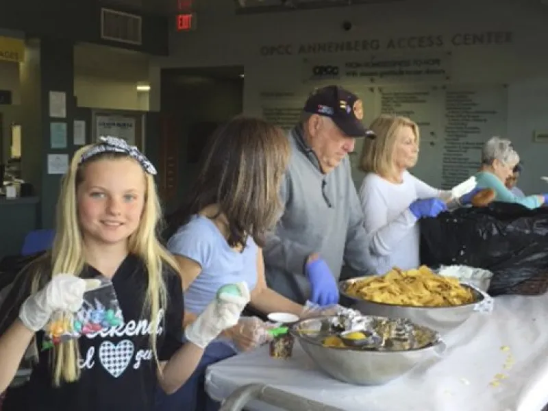 Mother's Kitchen volunteers serving fresh meals