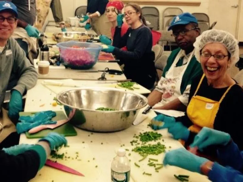 Mother's Kitchen volunteers preparing a soup-kitchen meal