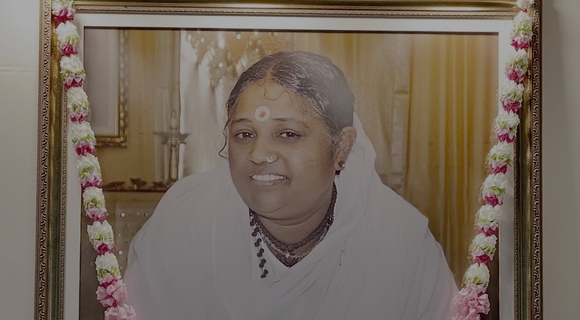 Close-up of Amma's photo on altar