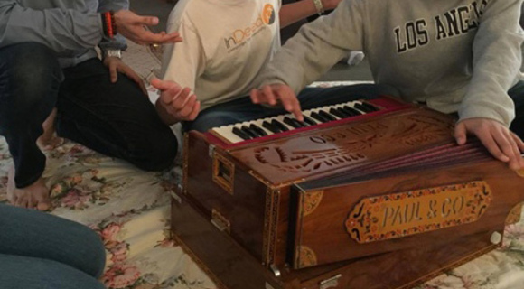 Hands playing harmonium