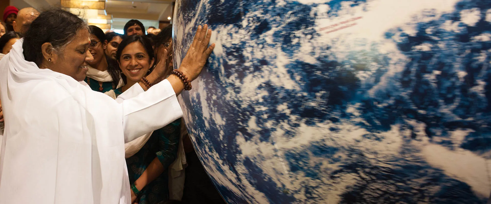 Amma touching Globe