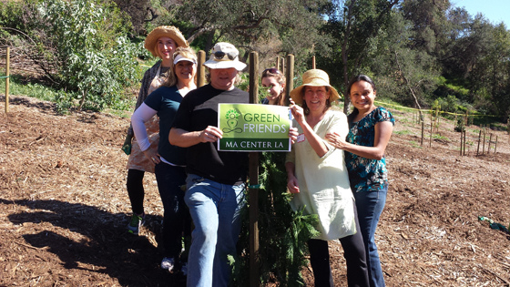 Greenfriends at Tree People event with a newly planted tree