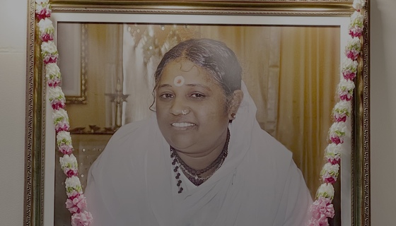 Close-up of Amma's photo on altar