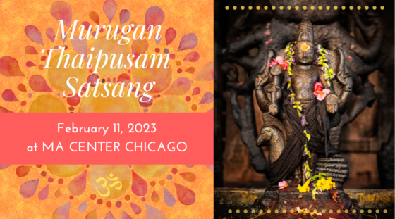 A stature of Lord Murugan adorned with flowers