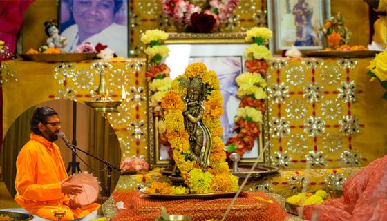 Krishna murthi with garland on altar with Ramanandamrita Chaitanya
