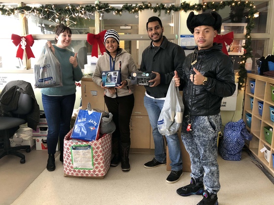 AYUDH volunteers dropping off items donated during their Holiday Gift Drive to Youth Without Shelter