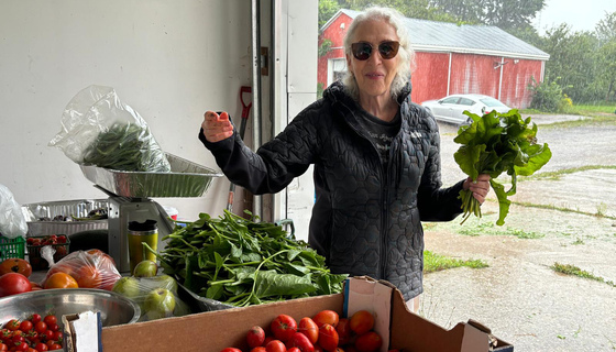 Satsang member buying veggies