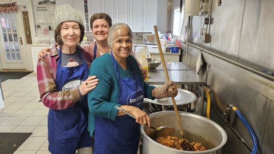Volunteers making chilli