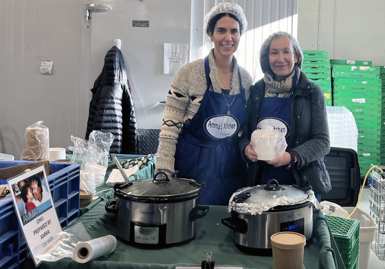 Volunteers serving chilli at Georgetown Bread Basket