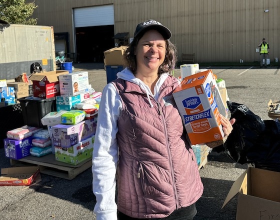 M.A.Center Volunteer working to organize and distribute essentials