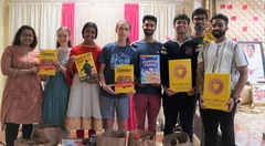 A group of AYUDH members holding boxes for a food drive