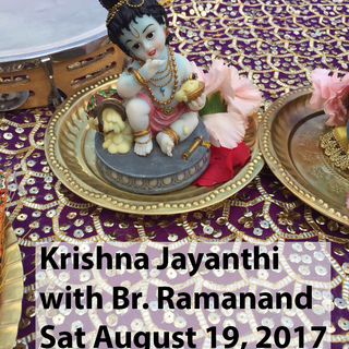 Baby Krishna murti on a brass plate with flowers