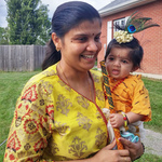 Mother and baby dressed as Krishna