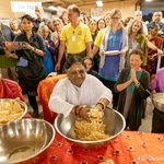 Retreat dinner - Amma crushing pappad for kids- people watching