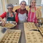 Volunteers shaping cookies
