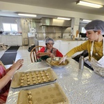 Volunteers shaping cookies