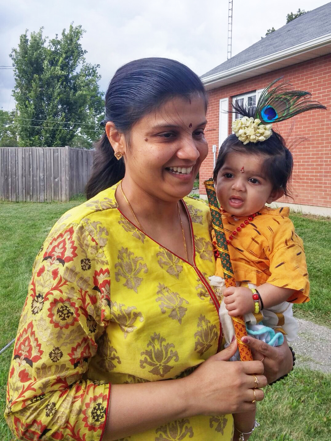 Mother with Baby dressed as Baby Krishna