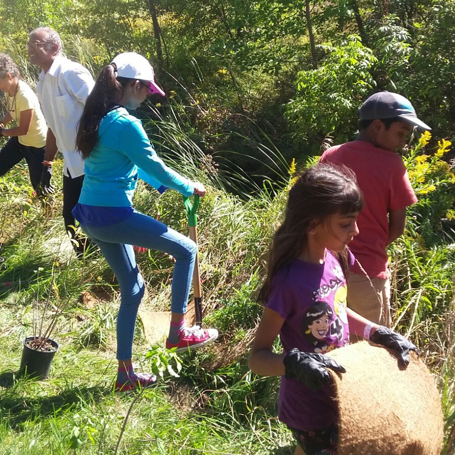 Amrita Bala Kendra kids participating in tree planting