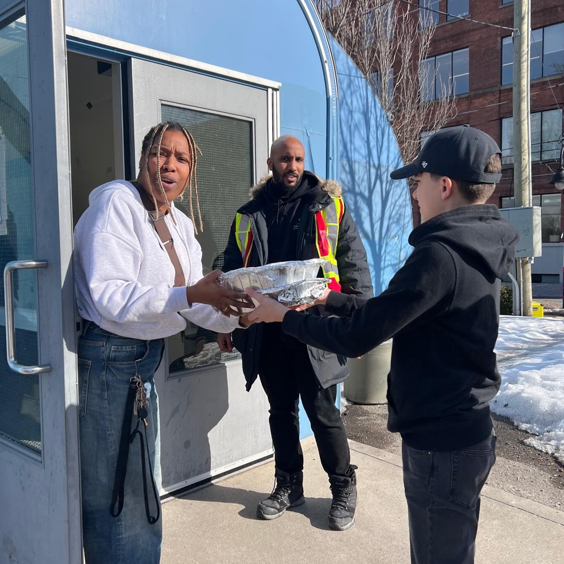 Amma Canada volunteer delivering cookies to St Felix Staff