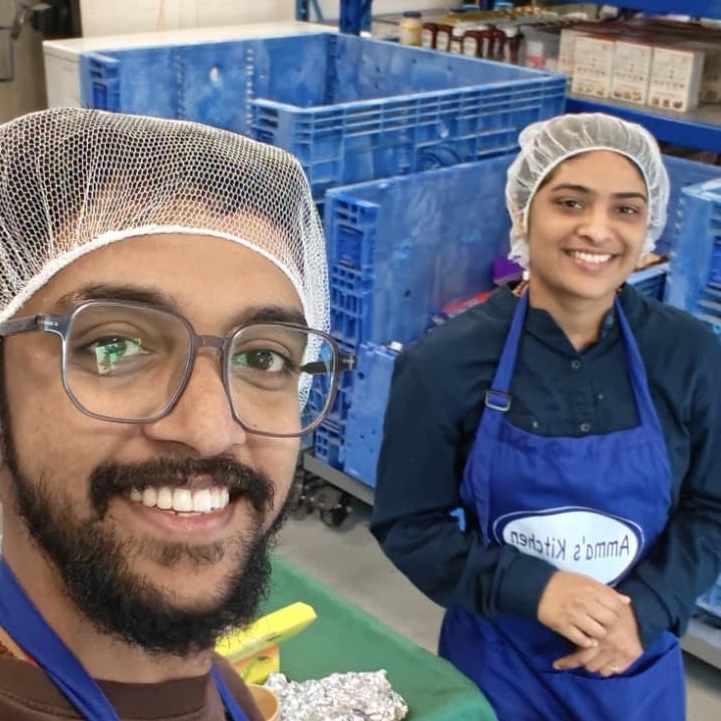 Youth volunteers serving chilli at GBB