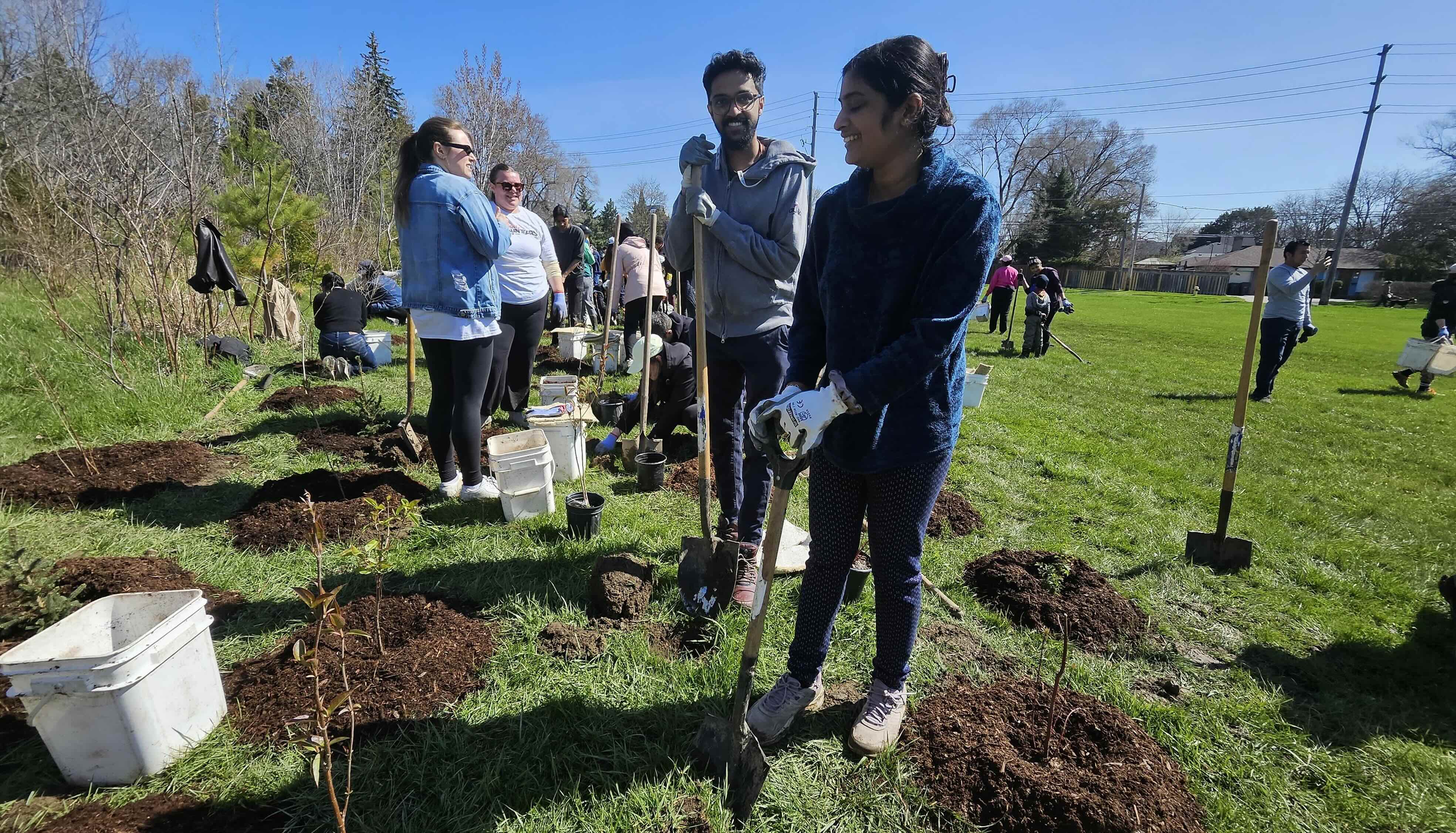 Many volunteers tree planting at Neilson Park Apr 26 2026