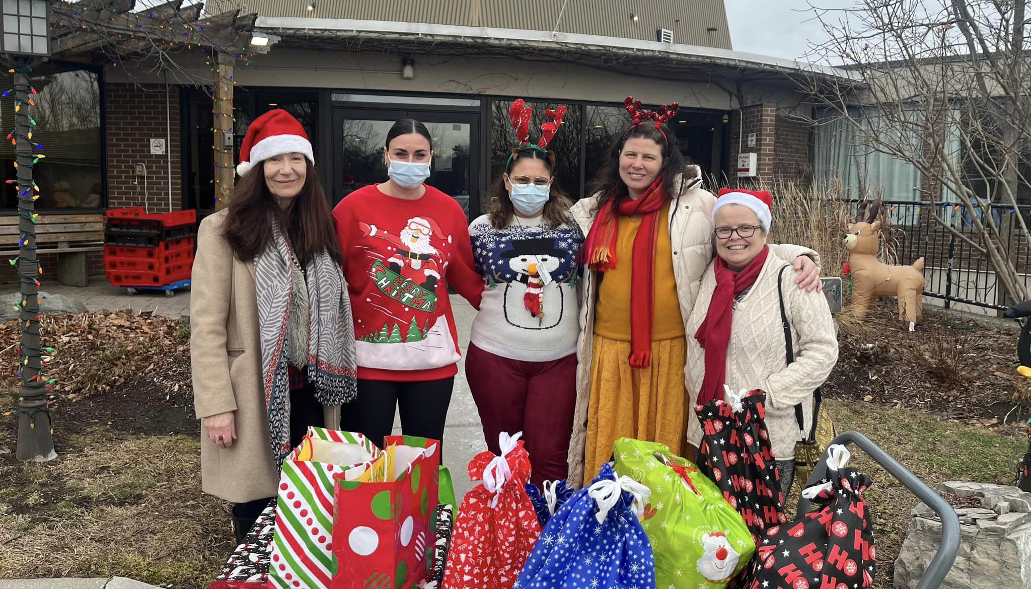 Toronto Satsang volunteers delivering gifts for eight Bennett Centre seniors