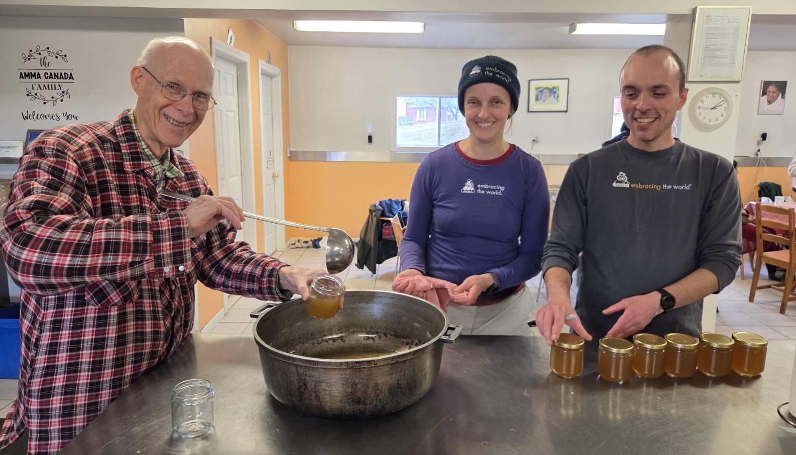 Volunteers bottling maple syrup