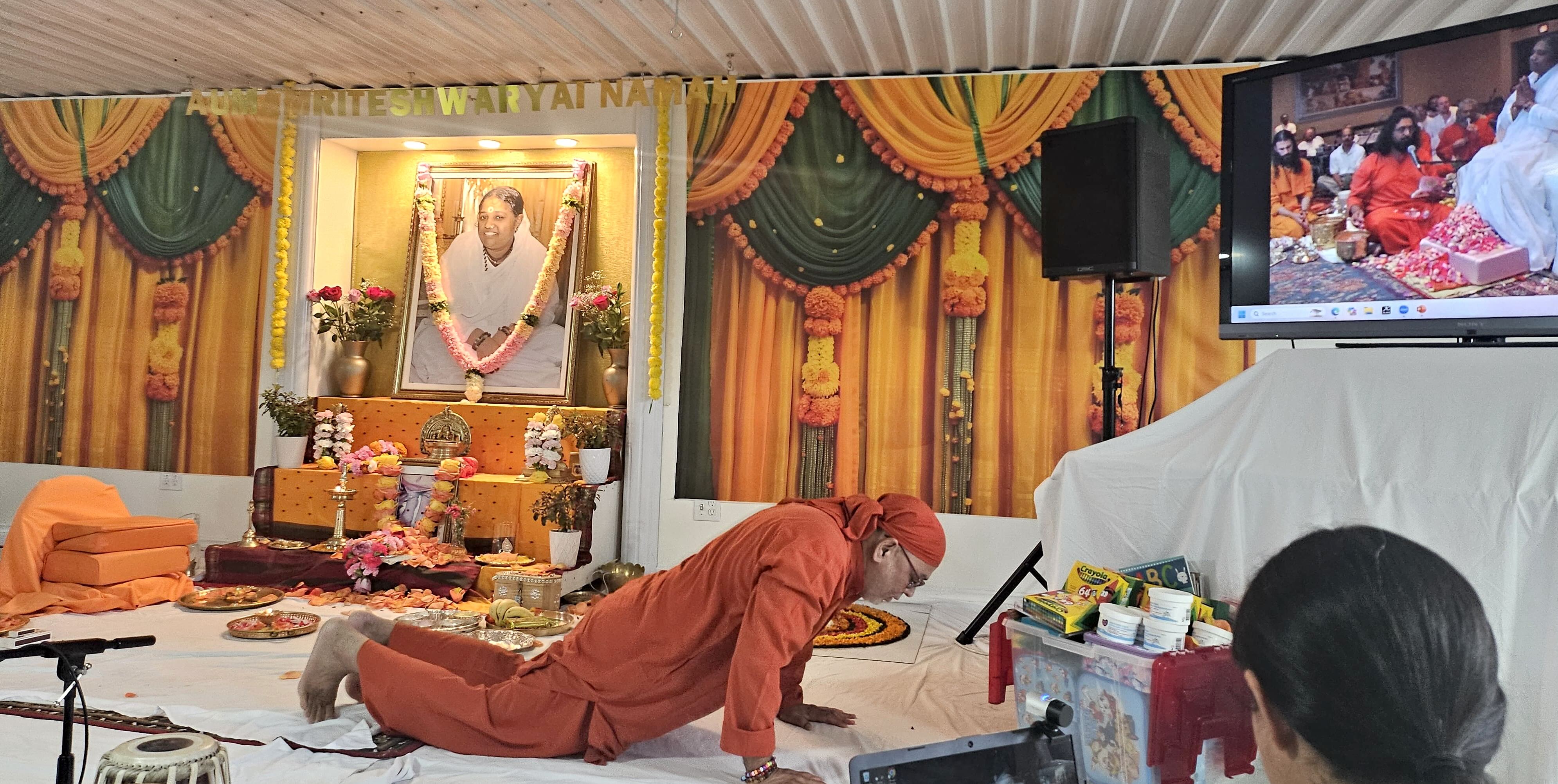 Dayamrita Swamiji prostrates to AYUDH gifts for students
