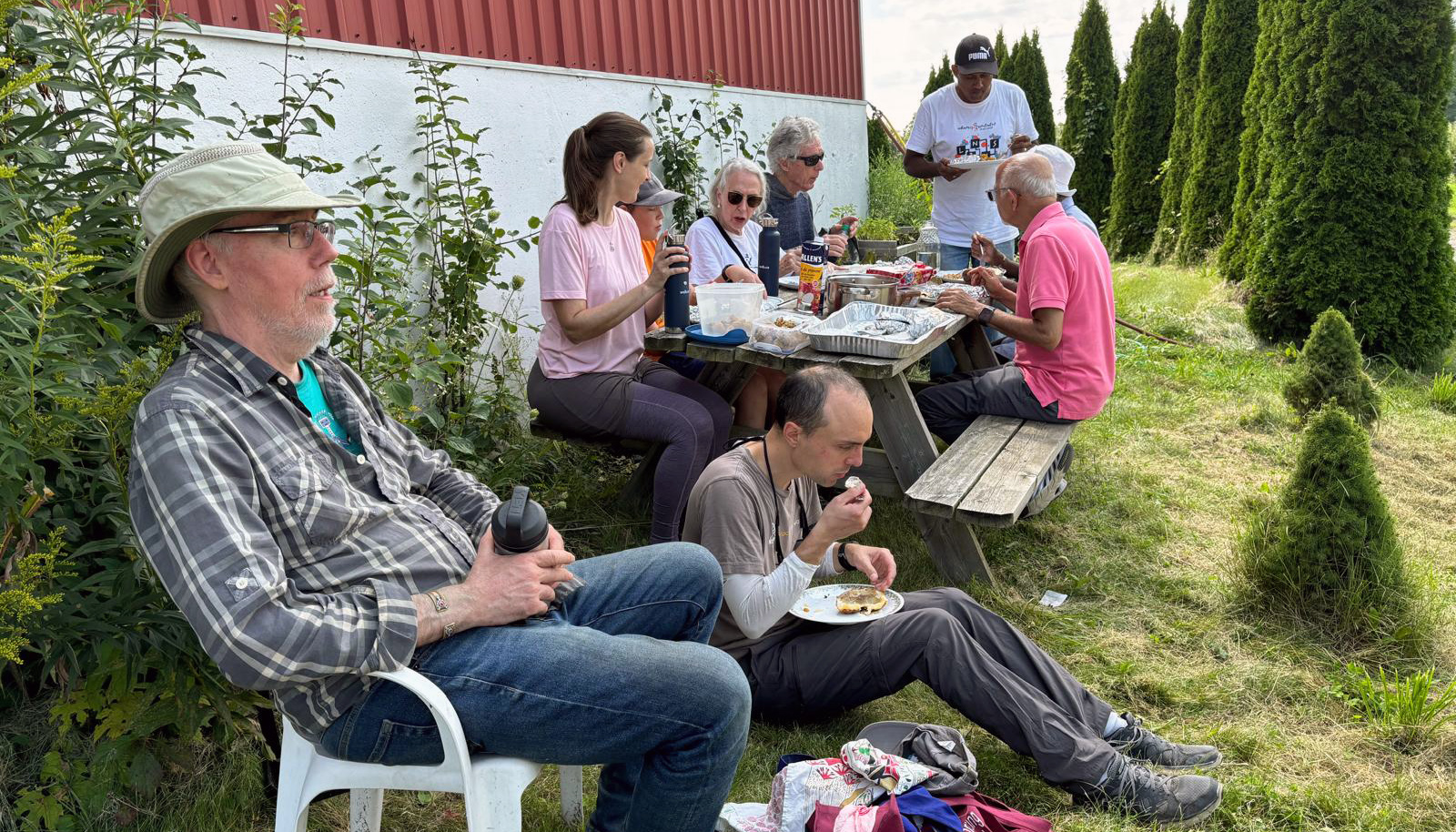 Amma Canada Farm Team eating lunch outside together