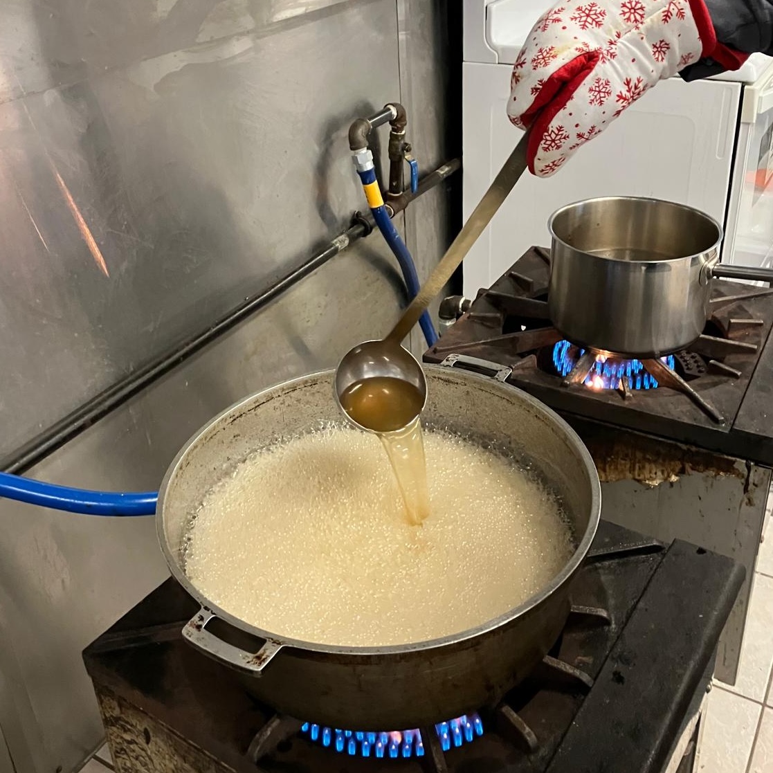 Finishing maple syrup on stove