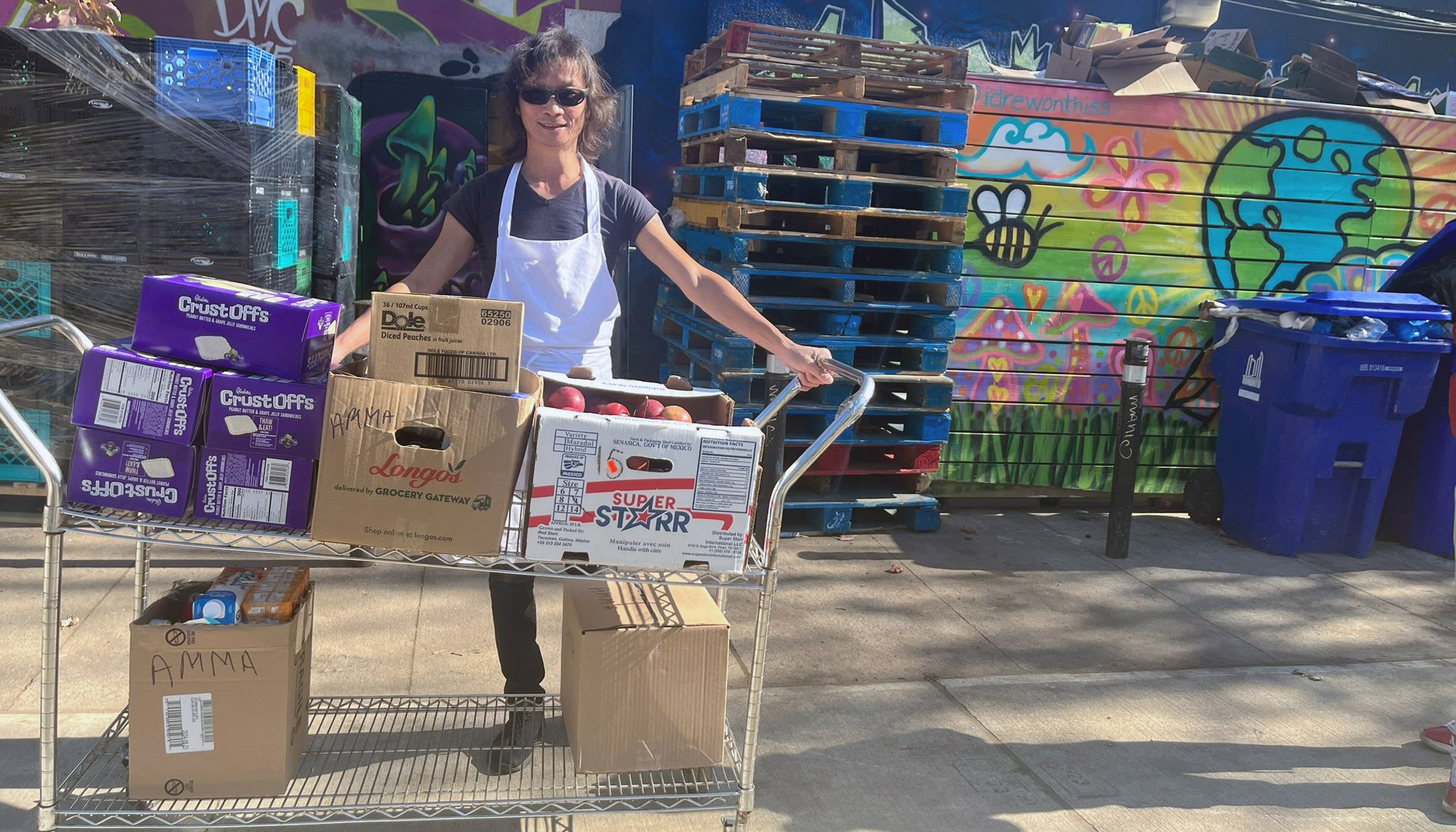 Staff from Fort York Food Bank receiving food donations from Amma Canada's Food Rescue Project