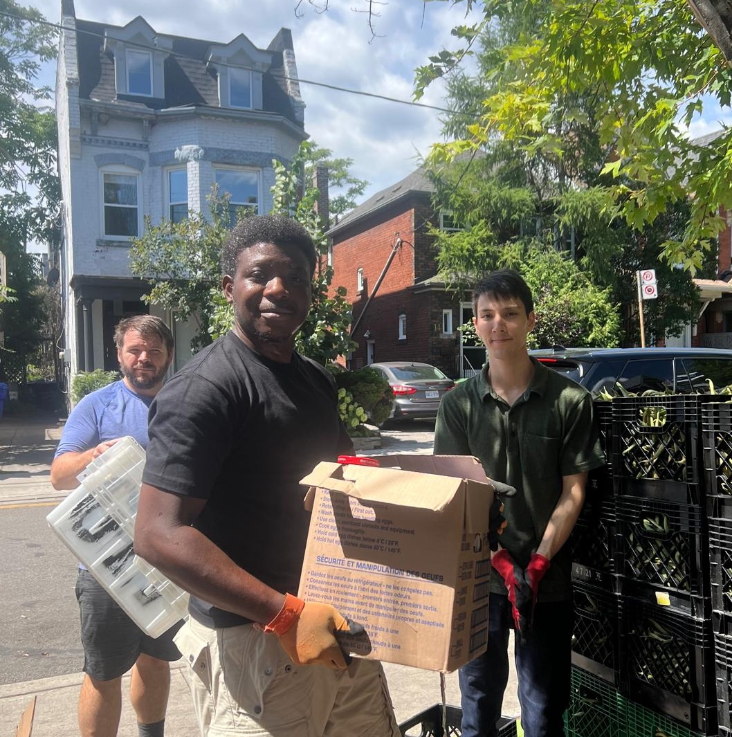 Fort York Food Bank volunteers with donated Kraft Dinner