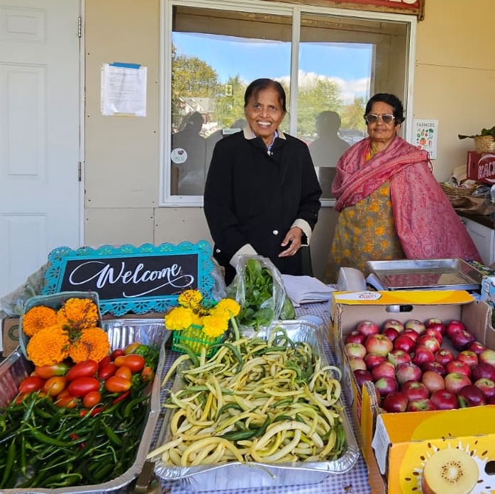 Volunteers selling product at farm stand