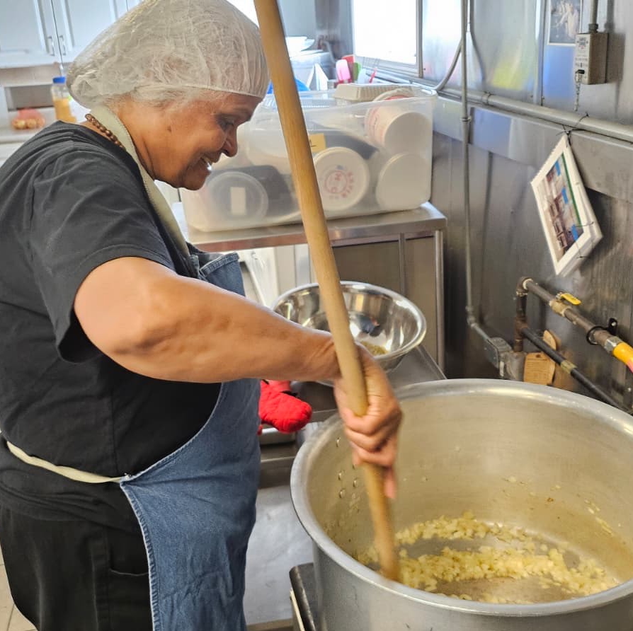 Amma Canada volunteer cooking chilli