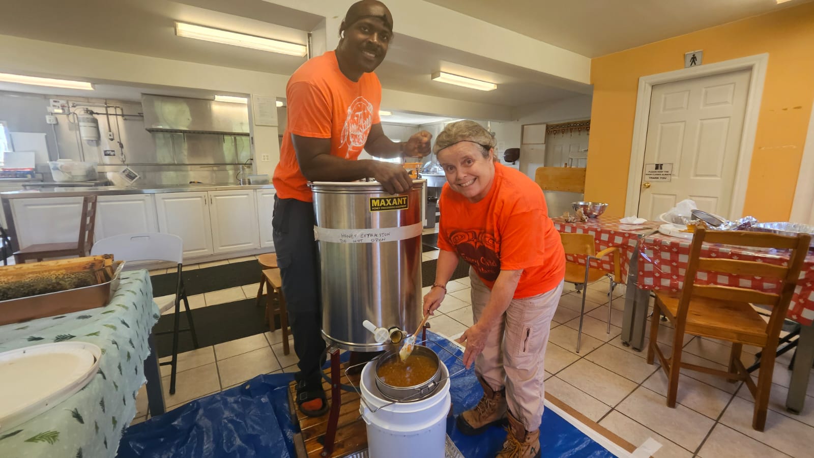 Kwame & Pauline harvesting honey
