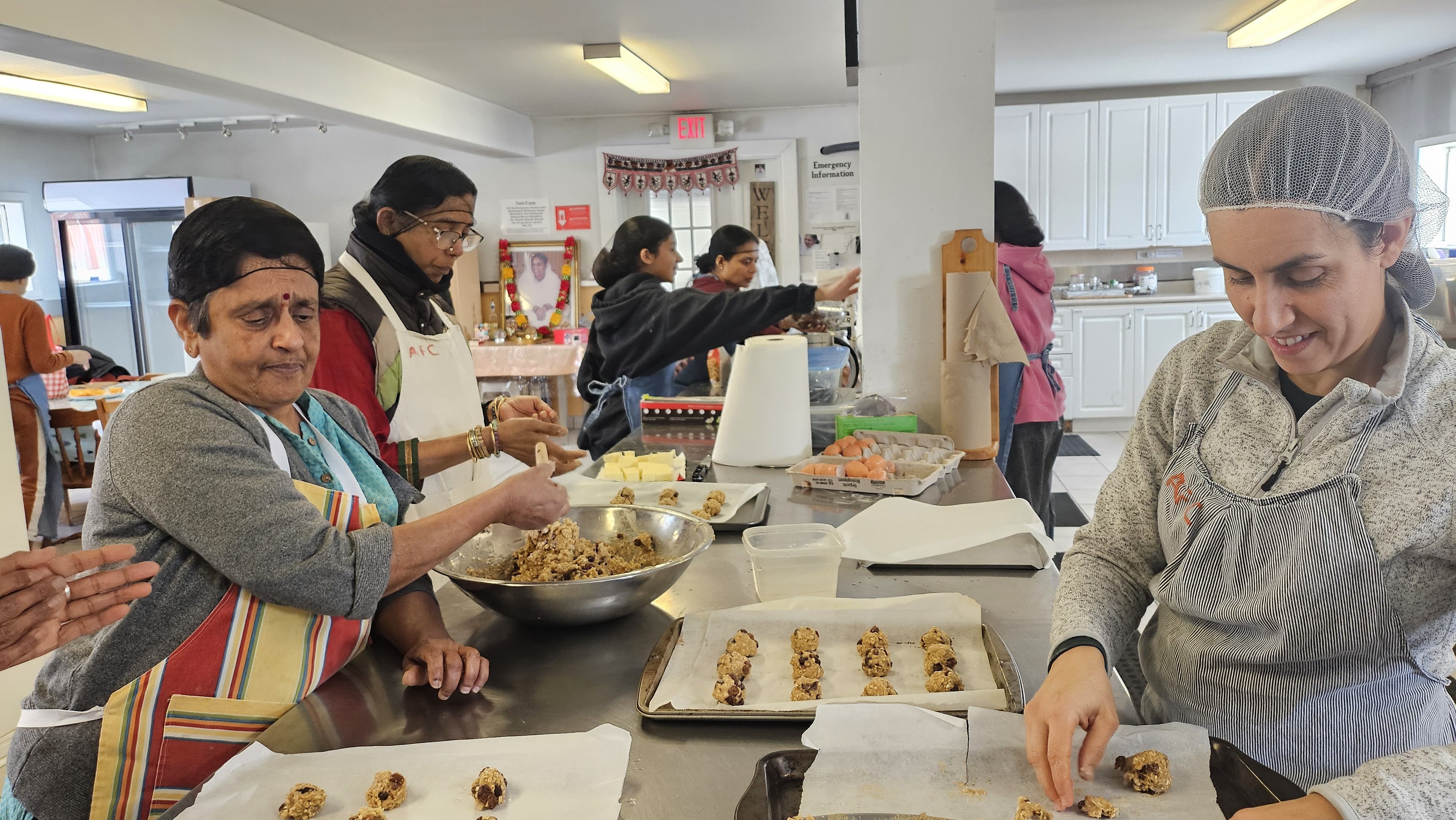 Volunteers shaping cookies